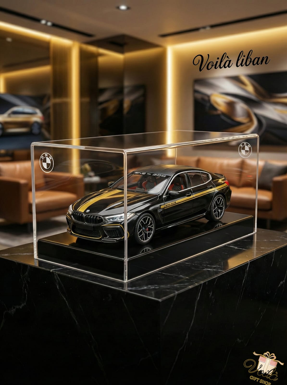 Model car in a clear display case on a marble surface with 'Voila liban' branding in the background.