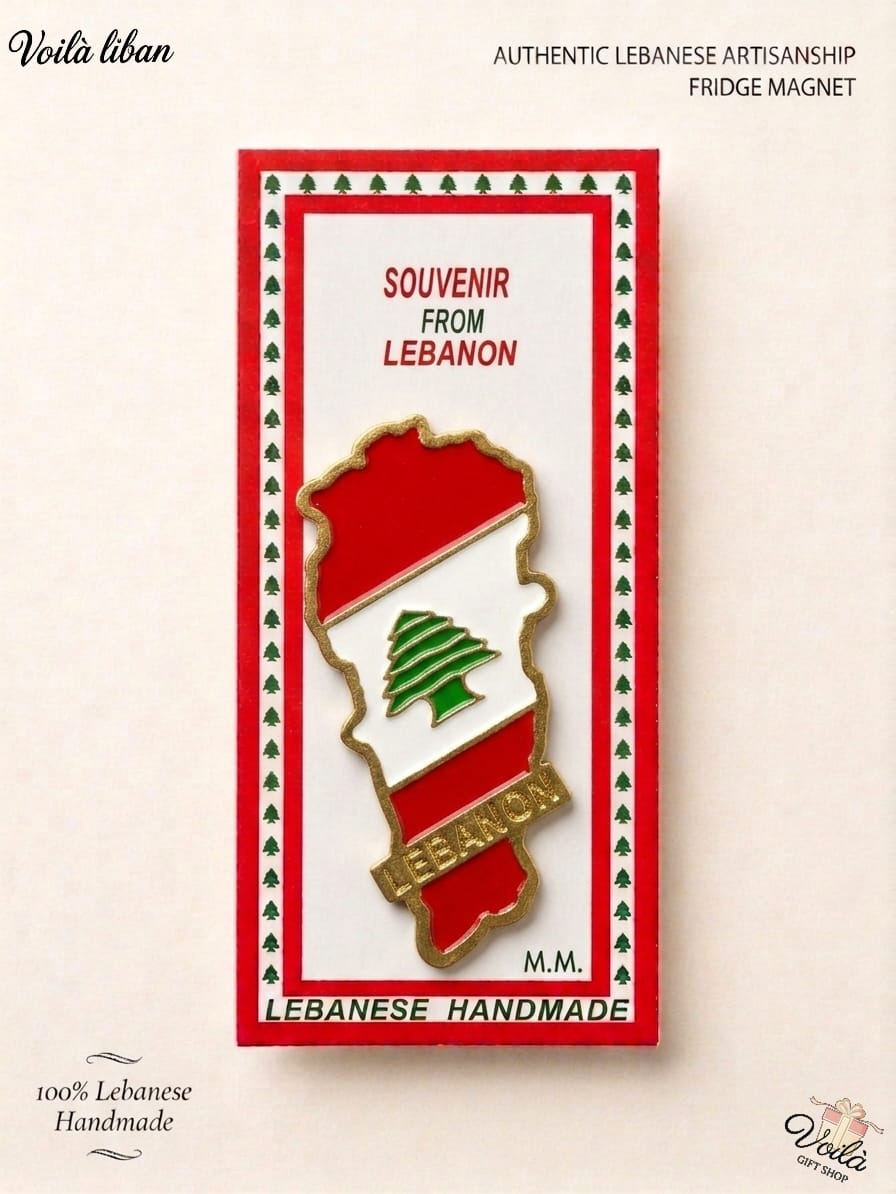 Authentic 100% handmade Lebanese fridge magnet shaped like the map of Lebanon, filled with the national flag colors and a gold Lebanon banner, in premium souvenir packaging.