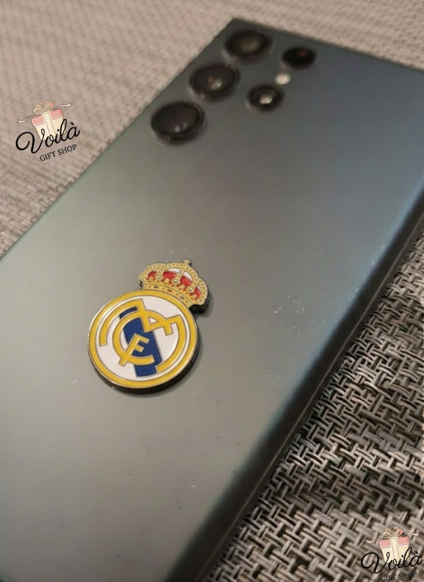 Phone case with Real Madrid logo on a textured surface