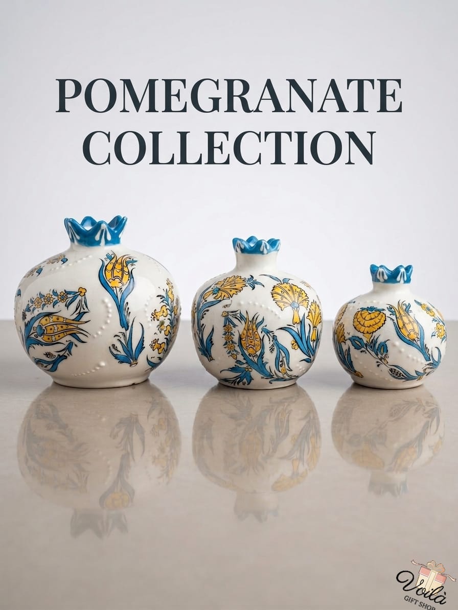 Set of three traditional ceramic pomegranate vases featuring classic blue and yellow Iznik tulip designs on a white background.