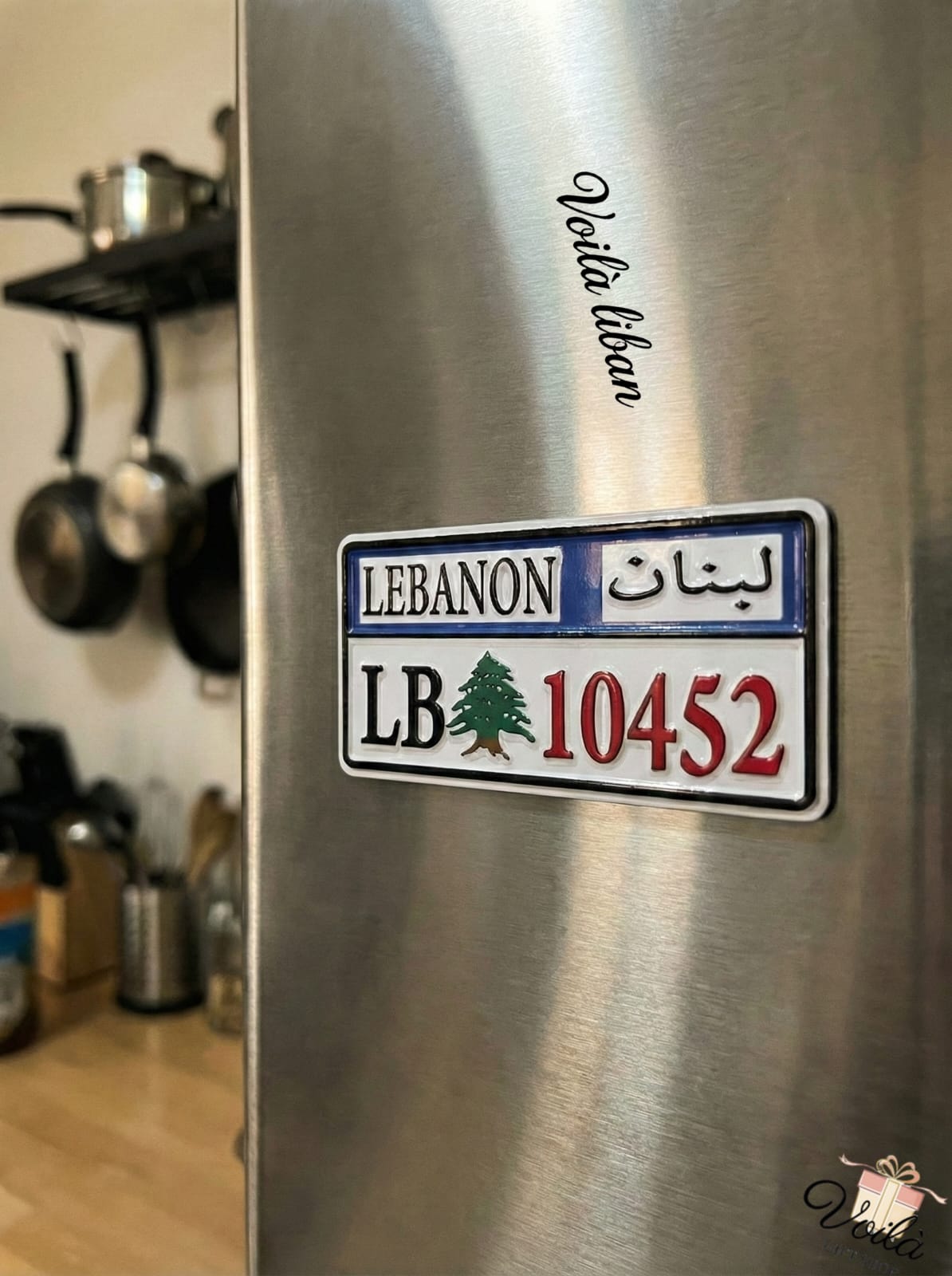 Sticker resembling a Lebanese license plate on a refrigerator in a kitchen.