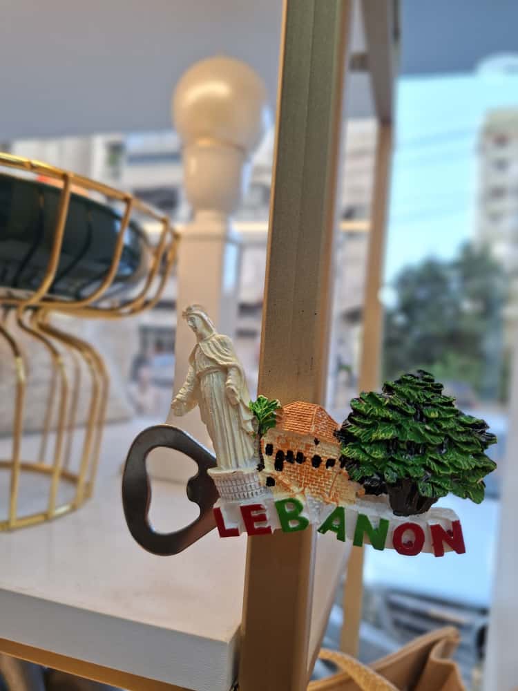 Decorative item with 'Lebanon' text and scenic design on a stand.