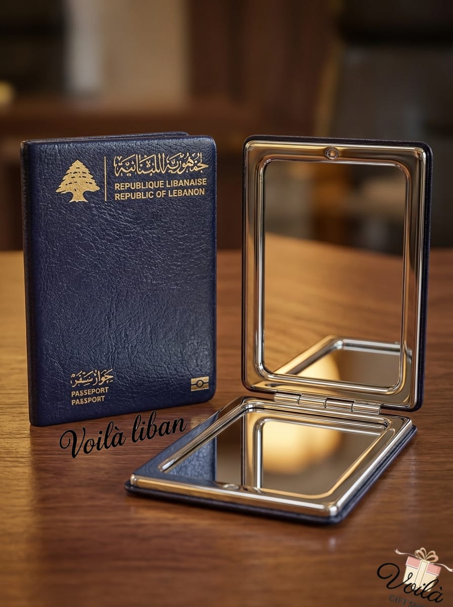 Lebanese passport and a compact mirror on a wooden surface