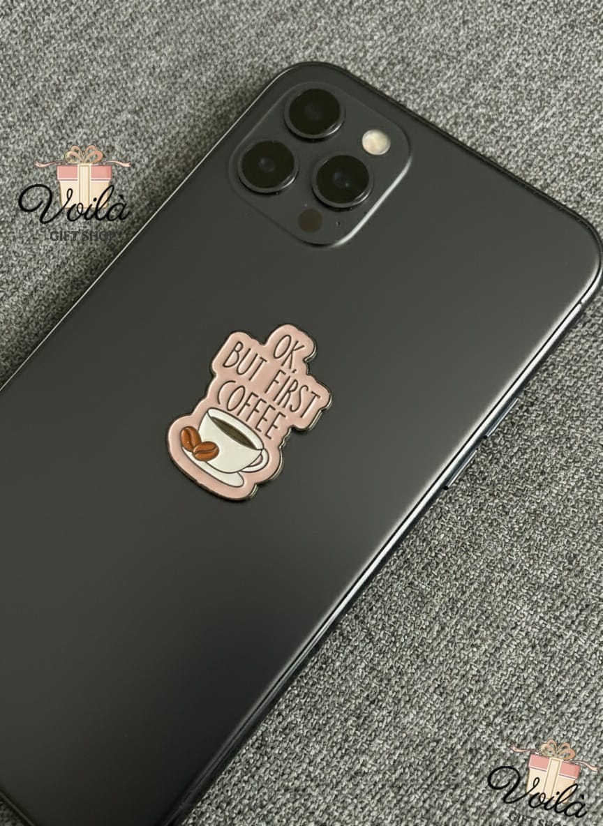 Phone case with 'But first coffee' design on a textured surface