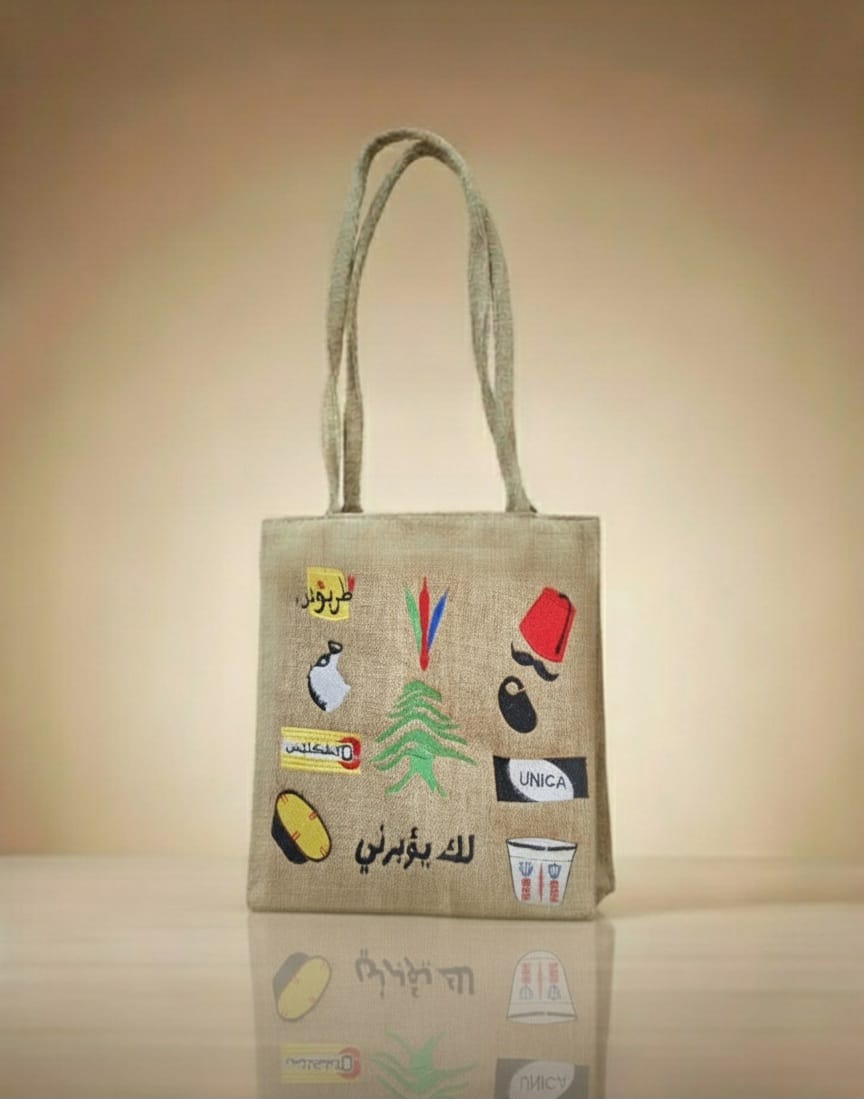 Jute bag with embroidered designs on a beige background