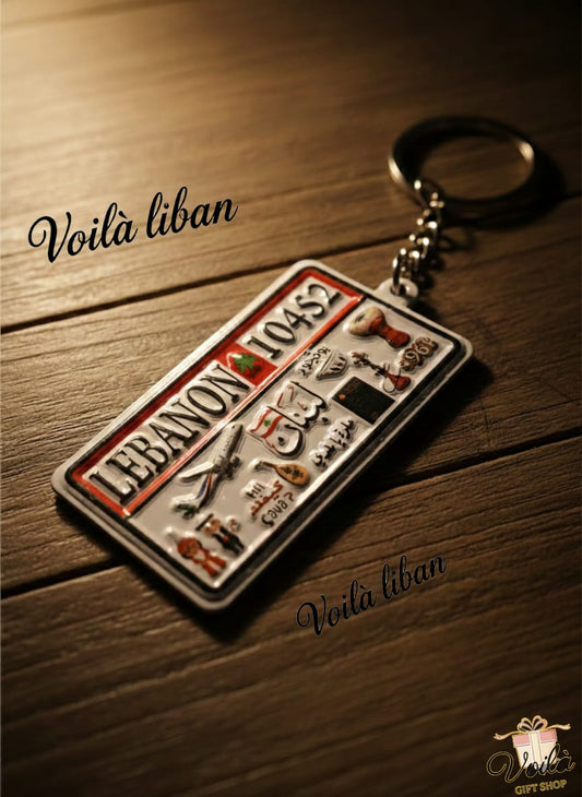 Keychain with Lebanese design on a wooden surface