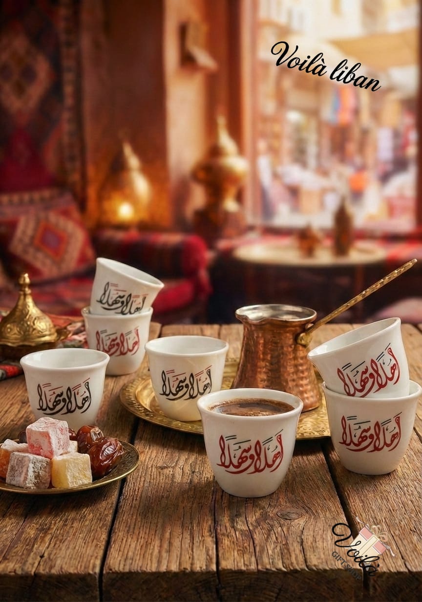 Café setting with cups, coffee, and Turkish delight on a wooden table with 'Voila Liban' branding.