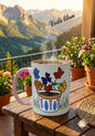 Mug with floral design on a wooden table with a mountainous landscape in the background