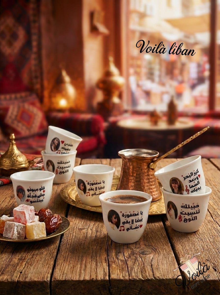 Café setting with cups, a copper pot, and Turkish delight on a wooden table with 'Voila Liban' branding.