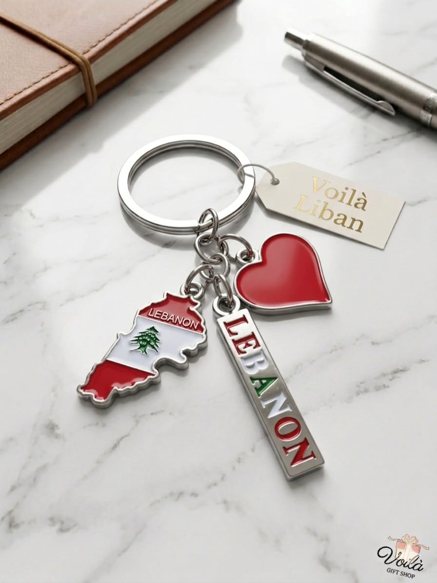 Keychain with Lebanon-themed charms on a marble surface