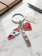 Keychain with Lebanon-themed charms on a marble surface