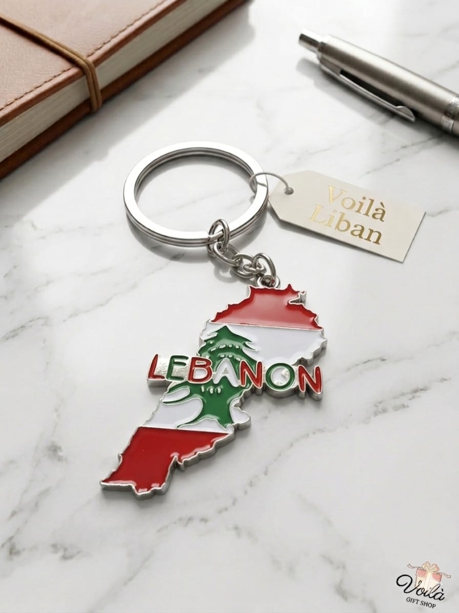 Keychain shaped like a map of Lebanon with the word 'Lebanon' on a marble surface.