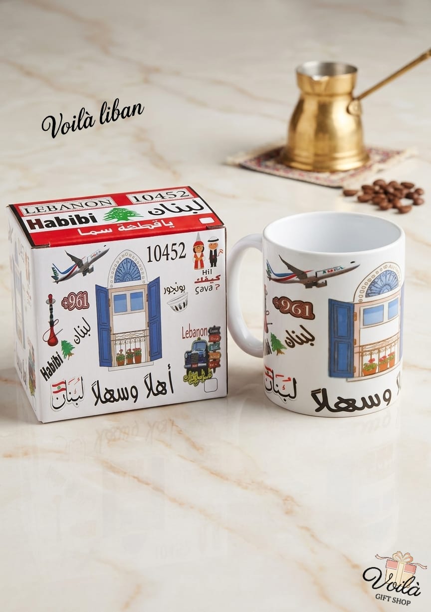 Lebanese-themed mug and packaging on a marble surface with coffee beans and a cezve.