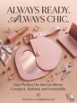 Blush pink heart-shaped compact mirror keychain with lipstick and keys on a wooden background
