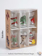 Set of six authentic hand-painted Lebanese glass tea cups featuring cultural motifs including the national flag, cedar tree, tarboush, oud, floral designs, and a lighthouse, presented in a premium display box.