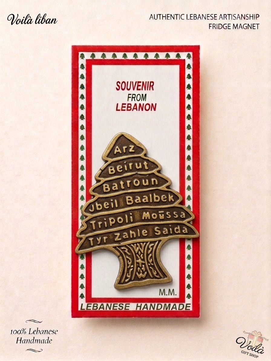 Authentic 100% handmade Lebanese fridge magnet featuring an antique bronze cedar tree engraved with cities like Beirut, Batroun, and Baalbek, in premium souvenir packaging.