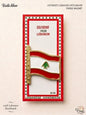 Authentic 100% handmade Lebanese fridge magnet featuring a waving enamel national flag attached to a gold flagpole engraved with the word Lebanon, in premium souvenir packaging.