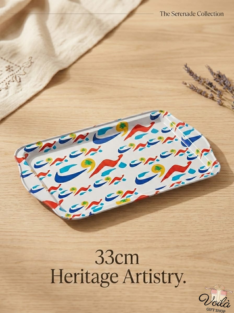 Colorful tray with abstract patterns on a wooden surface, featuring the 'Serenade Collection' branding.