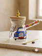 Hand-painted glass rakweh featuring a blue Lebanese taxi and dried flower handle