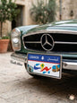 Vintage green car displaying a decorative Beirut Lebanon license plate featuring