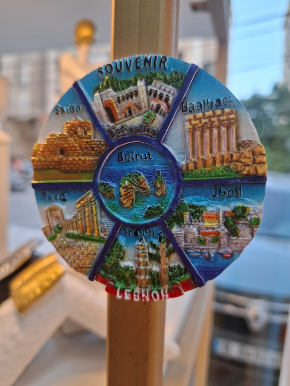 Decorative magnet with images of Lebanese landmarks on a stick
