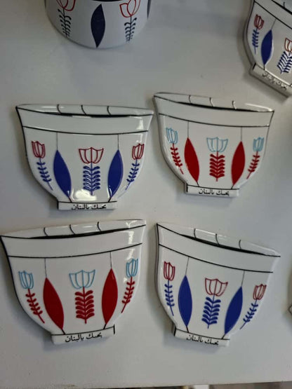 Set of ceramic wall bowls with floral designs on a white background