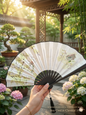Elegant classical folding hand fan with floral watercolor design and black tassel