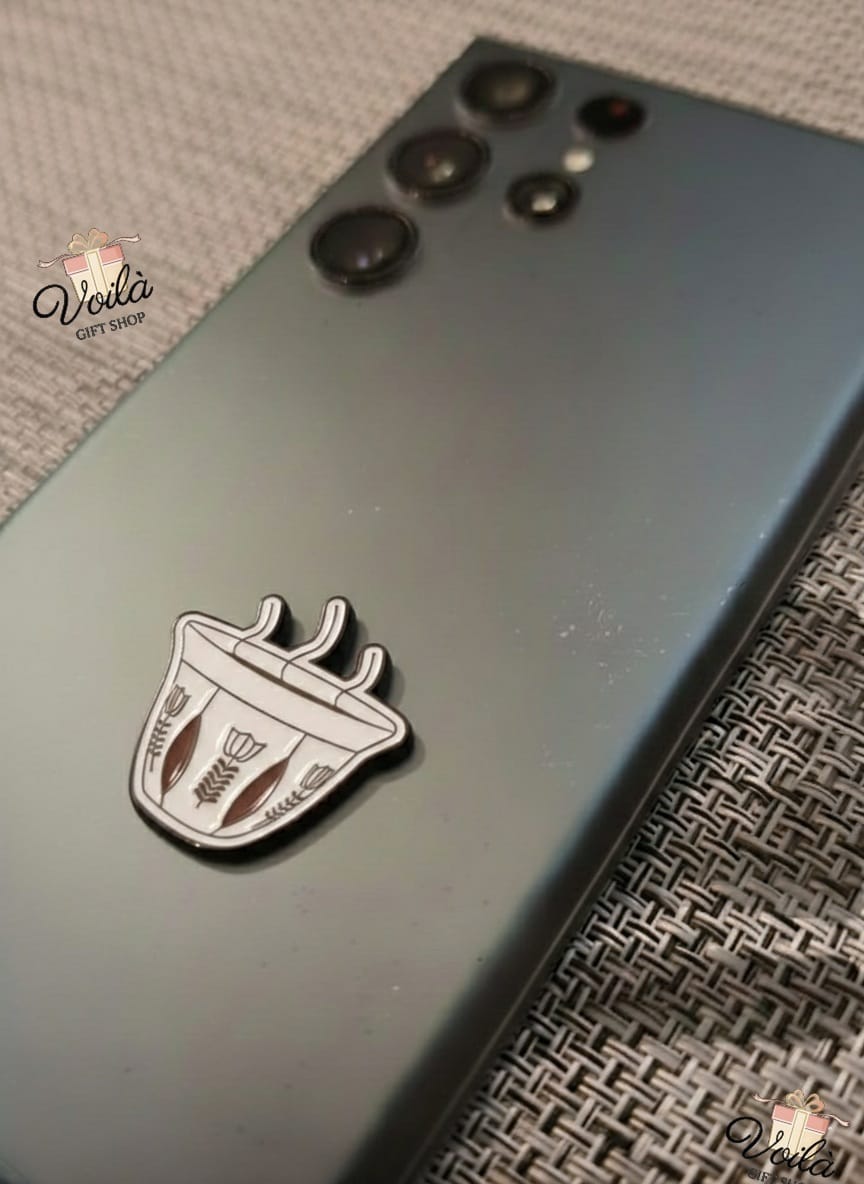 Phone case with a design of a coffee cup and saucer on a textured surface