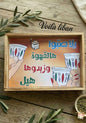 Decorative tray with coffee-themed illustration and 'Voila Liban' branding on a wooden surface.
