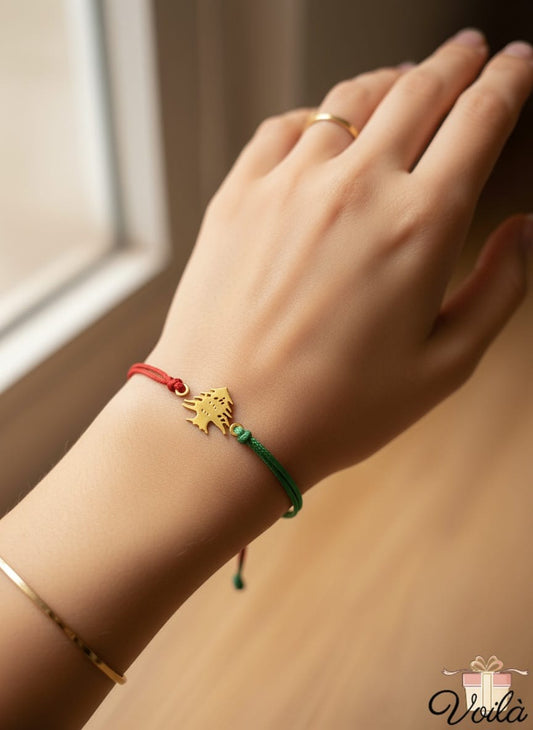 Hand wearing a colorful bracelet with a neutral background
