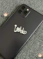 Phone case with 'love' design on a textured surface