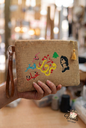 Handmade Fairuz embroidered burlap clutch with Lebanese cedar and Arabic calligraphy