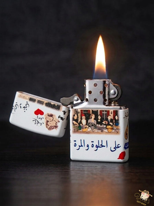 Lighter with a design of a scene and Arabic text, lit on a dark background