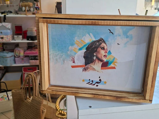 Framed artwork with a woman's portrait and text in an indoor setting