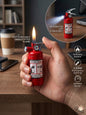 Red fire extinguisher-shaped lighter with flame and flashlight features, held in a hand on a desk.