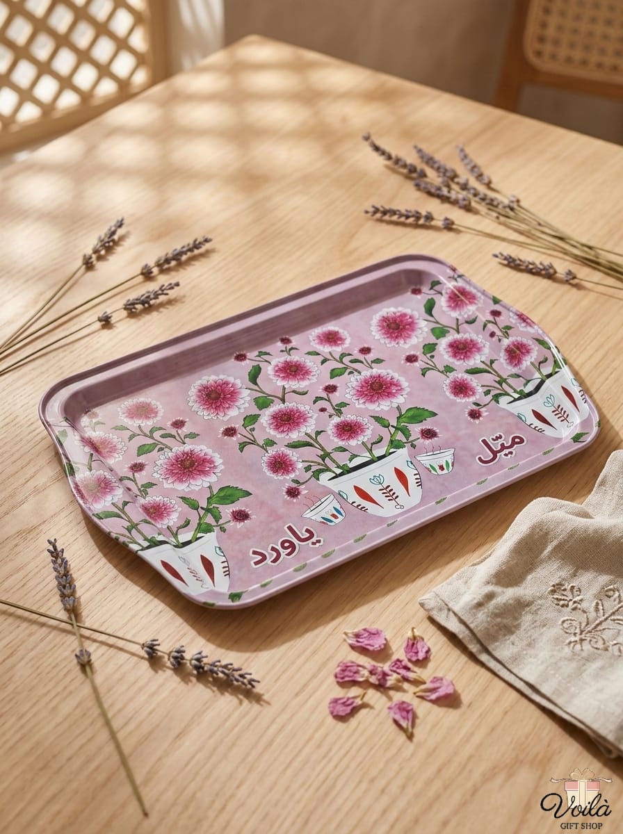 Decorative tray with floral design on a wooden table