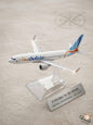 Model airplane with Flydubai branding on a light gray background