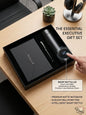 Executive gift set with smart bottle, notebook, and pen on a wooden surface.