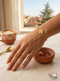 Gold Lebanese Cedar Tree Arz Bracelet on a woman's wrist