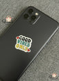 Phone case with 'Good Vibes Only' sticker on a textured surface