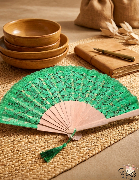 Handcrafted green lace folding fan with wooden ribs and tassel