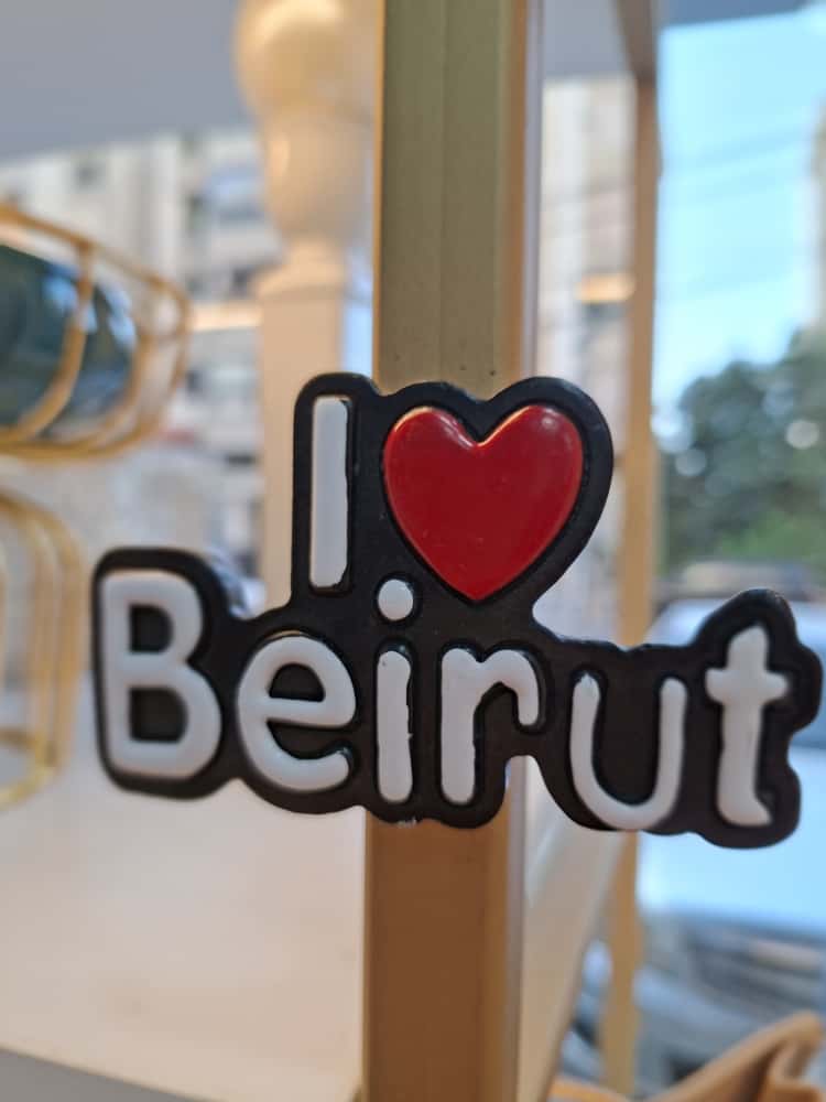 Fridge magnet with 'I ❤️ Beirut' text on a blurred background
