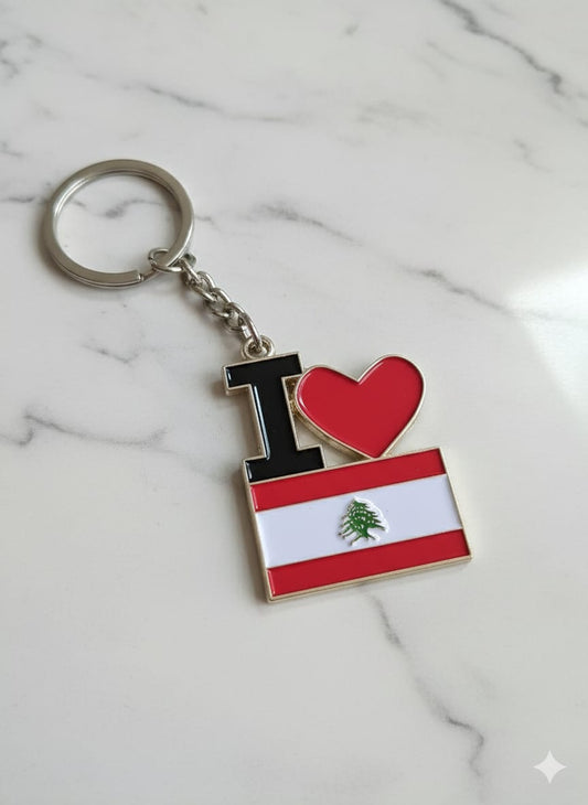 Keychain with 'I ❤️' heart and Lebanese flag design on a marble background