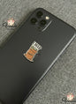 Phone case with a coffee cup design and 'I need coffee' text on a gray surface.
