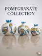 Set of three traditional ceramic pomegranate vases featuring classic blue and yellow Iznik tulip designs on a white background.