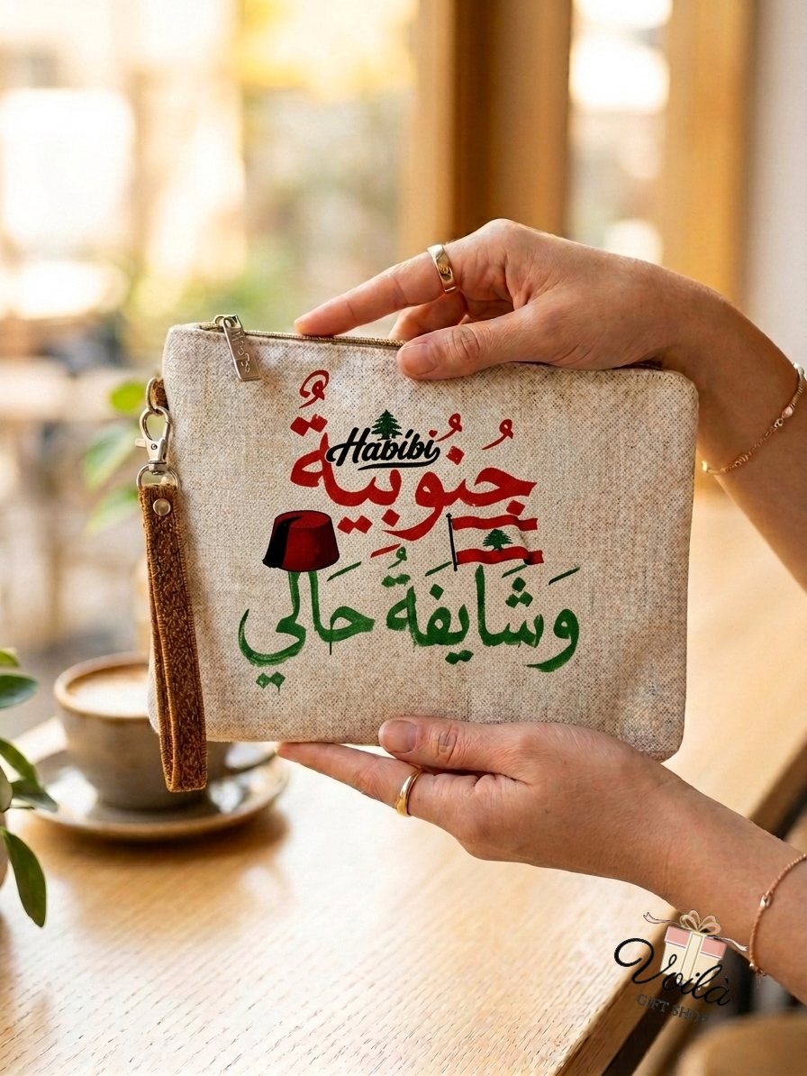 Linen clutch pouch featuring Lebanese flag, tarboush, and Arabic calligraphy reading Janoubiyyeh