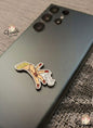 Phone case with a decorative design on a textured surface