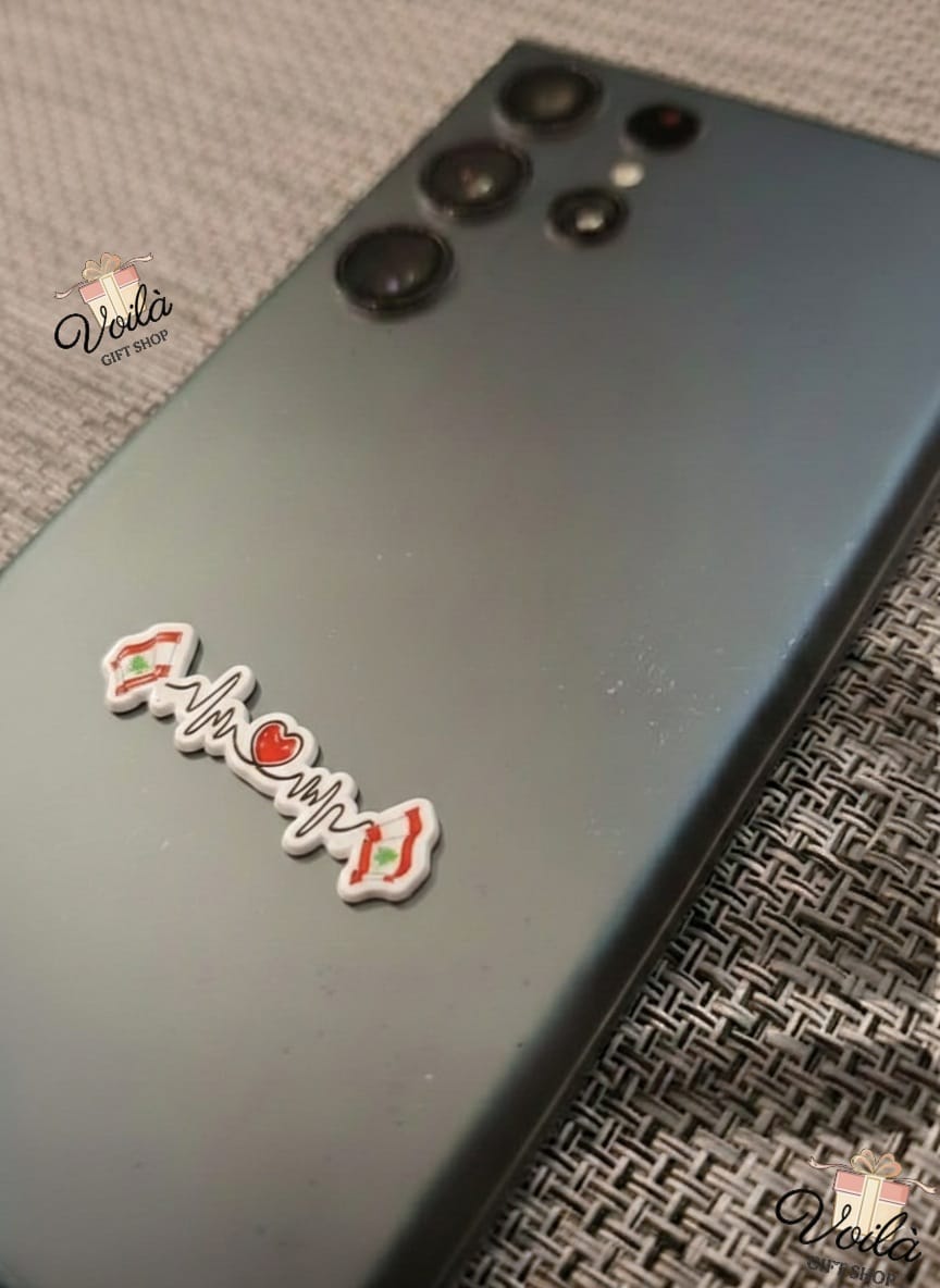 Phone case with 'The Camp' branding on a textured surface
