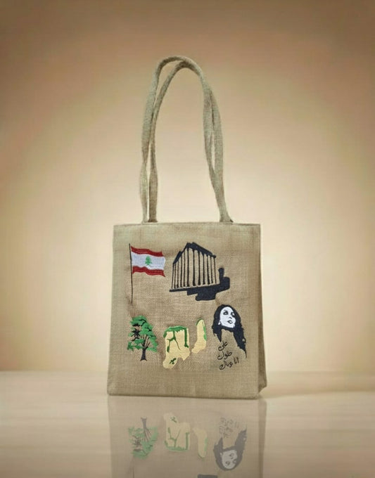 Jute bag with embroidered designs on a beige background
