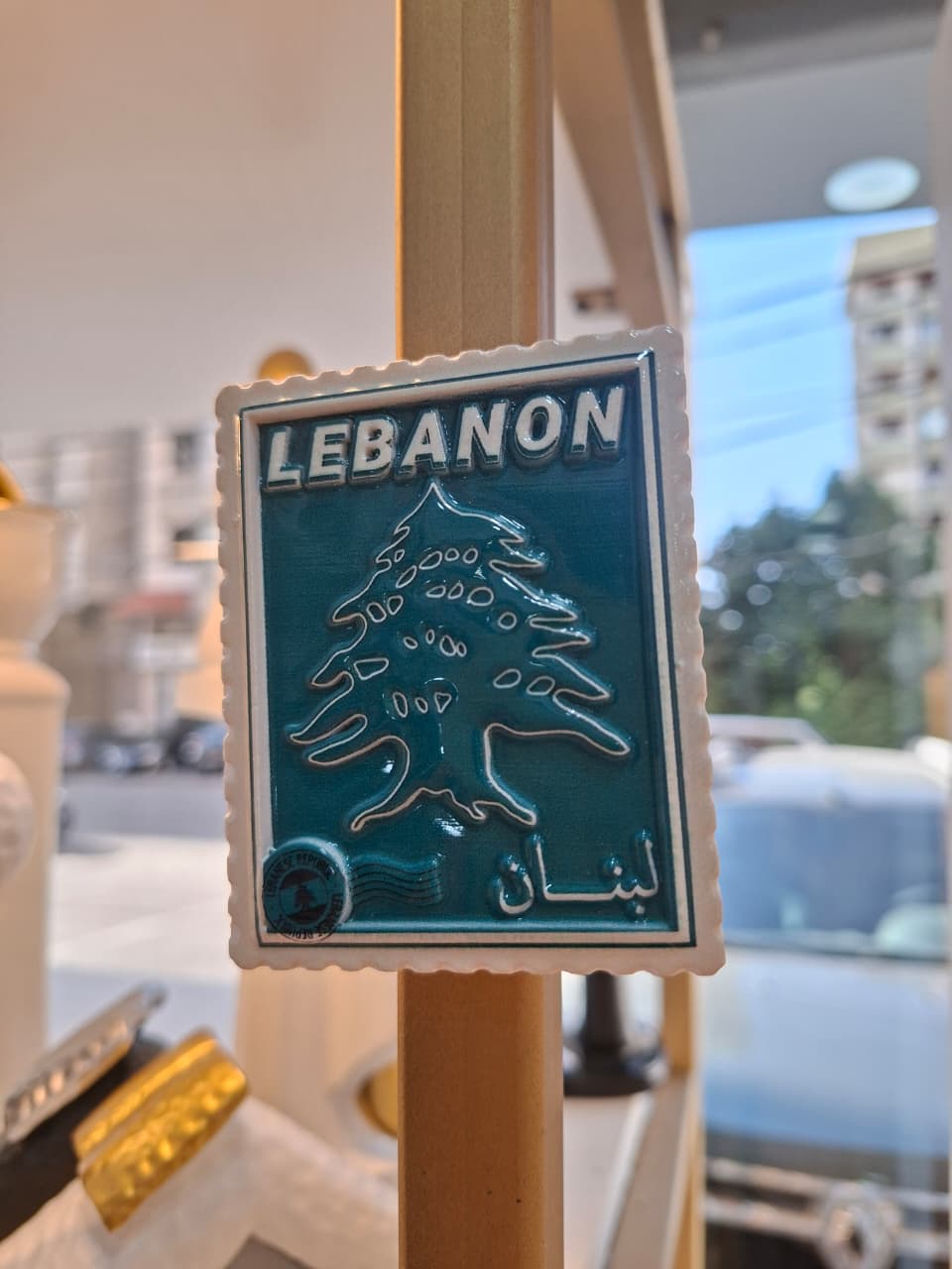 Lebanon-themed decorative item with a tree design in a store setting